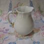 White Creamer with Gold Handled Trim