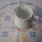 White Creamer with Gold Handled Trim
