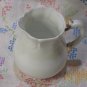 White Creamer with Gold Handled Trim