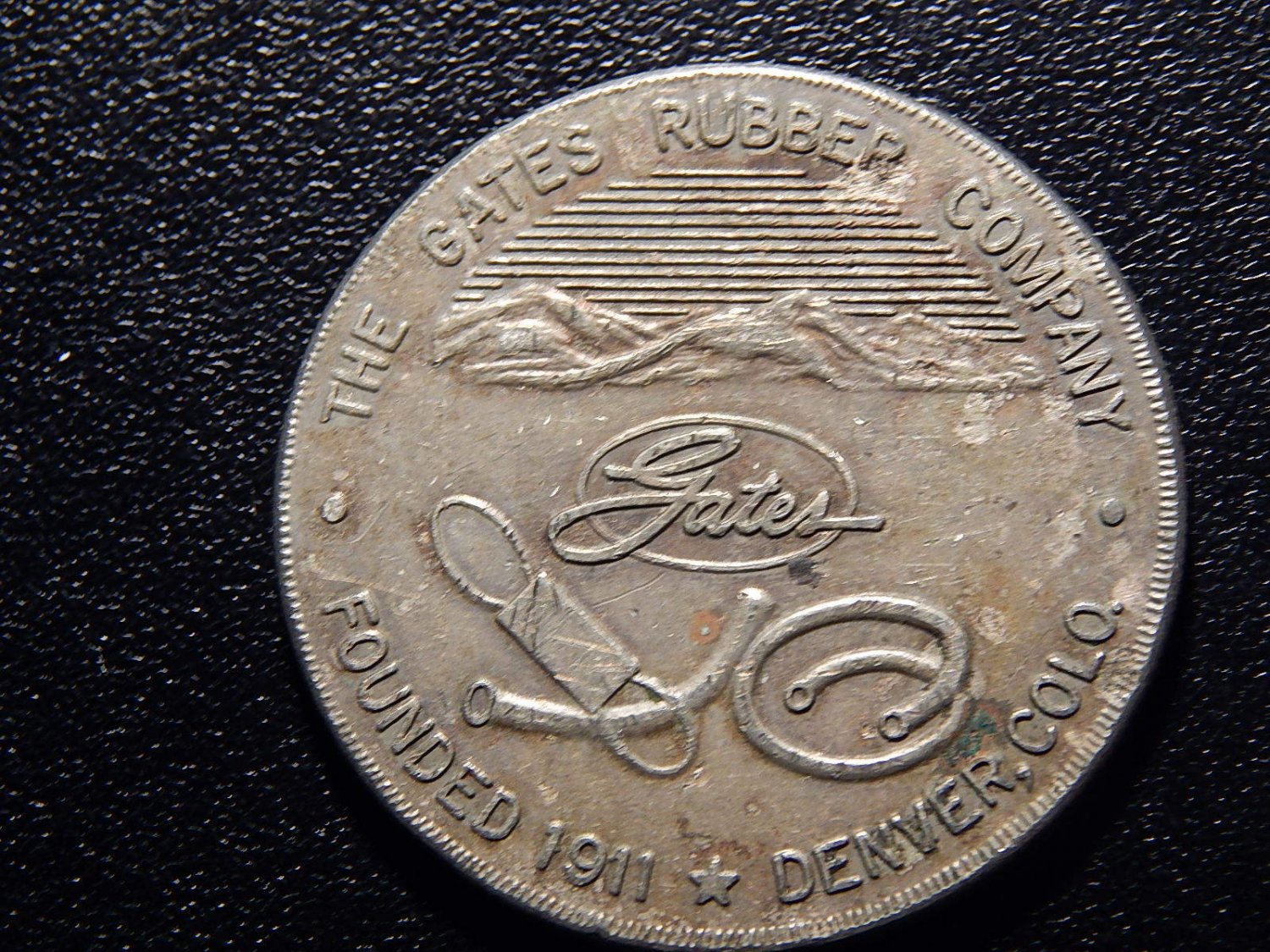 THE GATES RUBBER COMPANY FOUNDED 1911 DENVER, COLO TOKEN! QQ102USC2