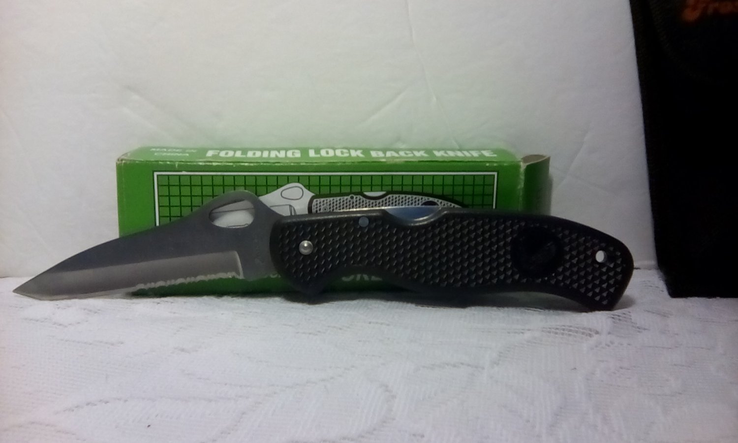 Folding lock blade pocket knife with sheath.