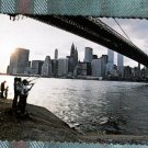 TWIN TOWERS of WORLD TRADE CENTER view from under the Brooklyn Bridge at dusk