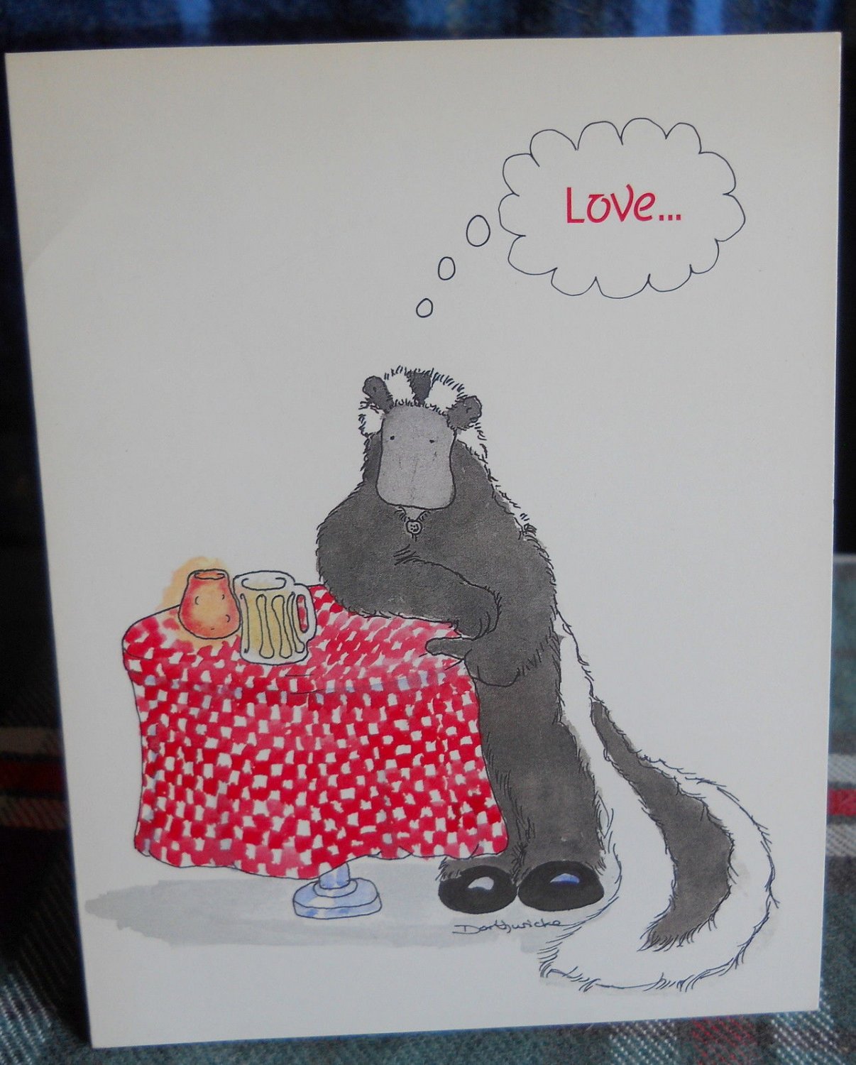 SKUNK at table wirh checkered cover &  beer stein comments-ON LOVE** UNUSED