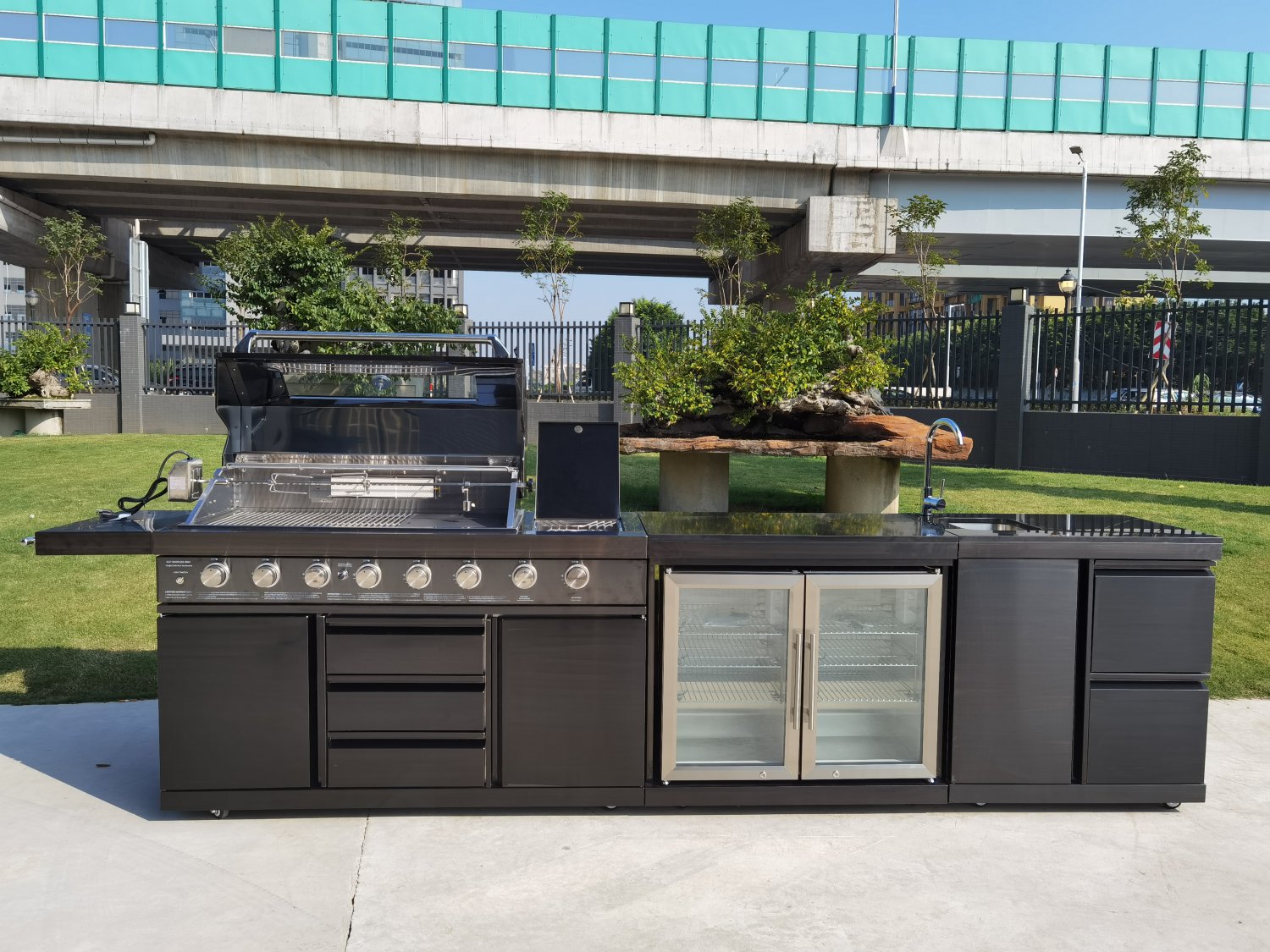 outdoor kitchen with sink and fridge