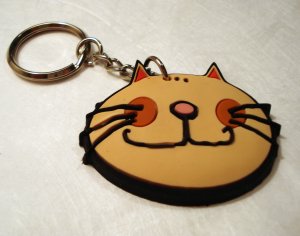 Comic cat face rubber key chain pale orange unused cm1295