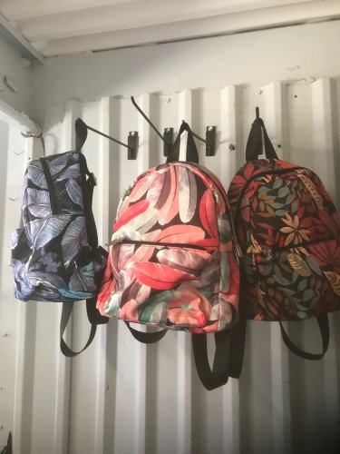Girl exotic flowers/ feathers book bags