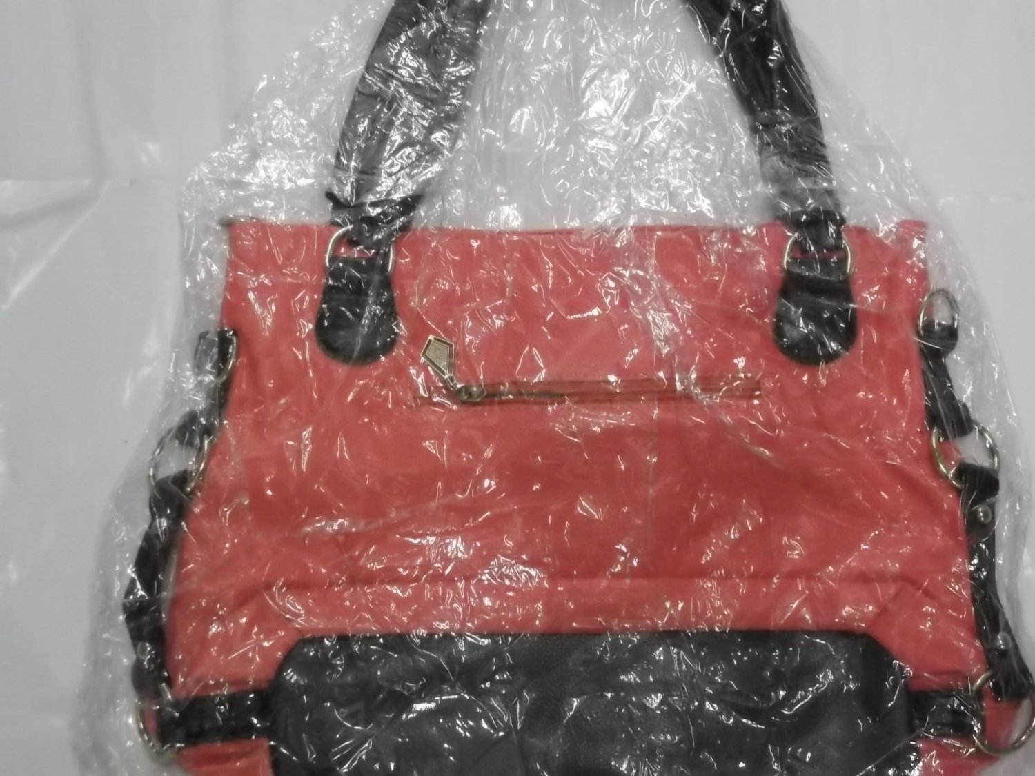 Pink And Black Leather Handbag