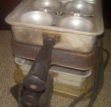 UNIVERSAL LANDERS, FERRY AND CLARK - COOKER - HAS POWER CORD, BUT A COUPLE OF PL