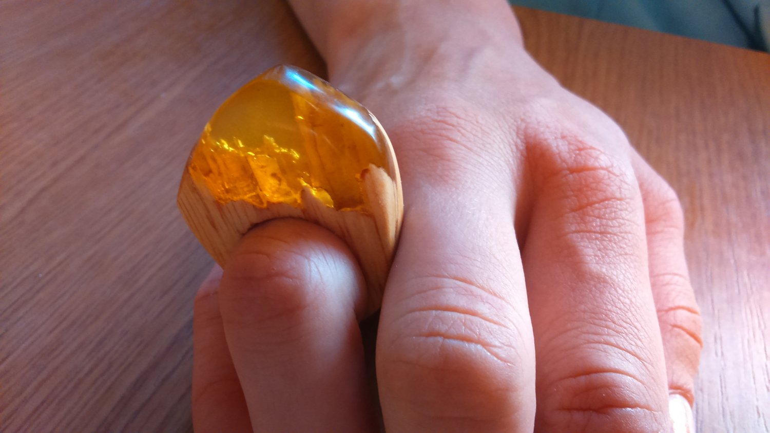 Amber color resin and wood ring
