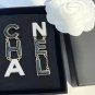 CHANEL Black Cream White Enamel Letter Gold Metal Earrings 24A NIB