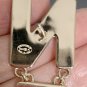 CHANEL Black Cream White Enamel Letter Gold Metal Earrings 24A NIB