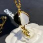 CHANEL Runway Black White Enamel Crystal Pendant Gold Metal CC Necklace NIB