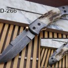 Stag scale Damascus steel folding knife with ,liner lock, knob, Leather sheath