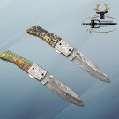 8.5" long Damascus steel folding knife with jigged Razen & engraved steel scale