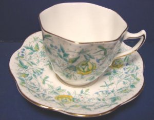 Rosina bone china cup and saucer England green yellow flowers porcelain ruffled gold trim edge