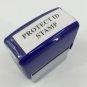 Blue Stapler Style Self-Inking Stamp Print Black Garbled To Mask Private