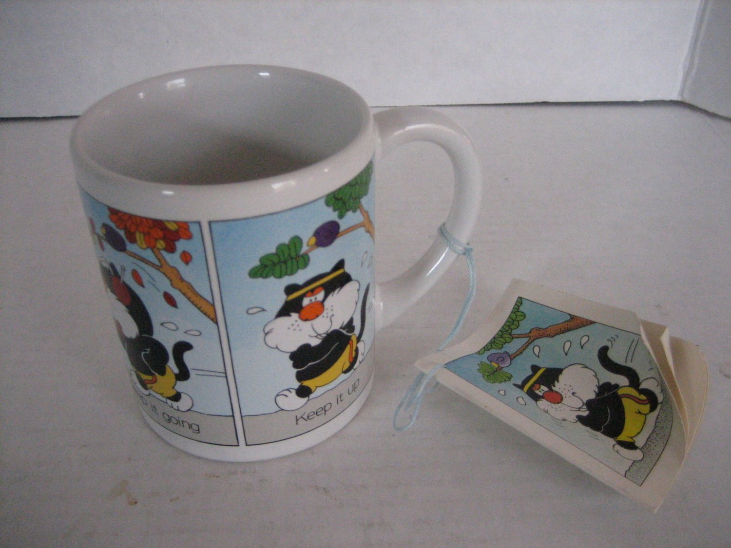 Applause Black/White Cat Exercising Ceramic Coffee Mug Cup New 3 in.Wx3 1/2 in.T