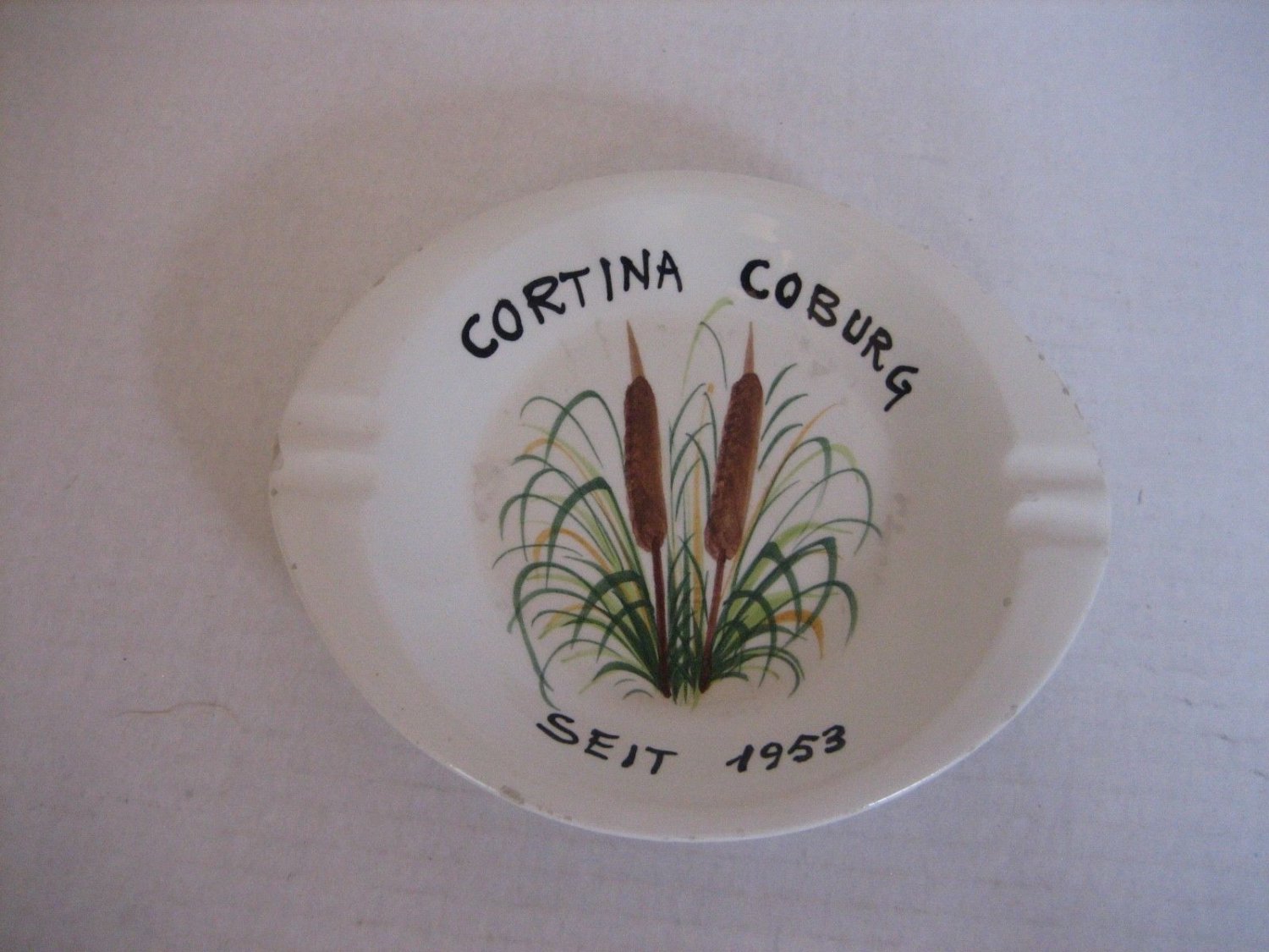 Vintage Cortina Coburg Seit 1953White Ceramic Oval Ashtray w/Cattails Pre-Owned