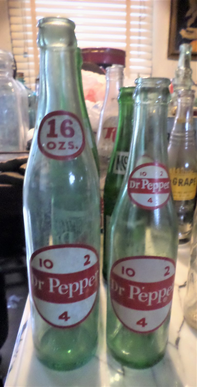 2 Vintage 1960s Dr. Pepper Soda Bottles. 16oz. and 10oz.  in ex. cond.