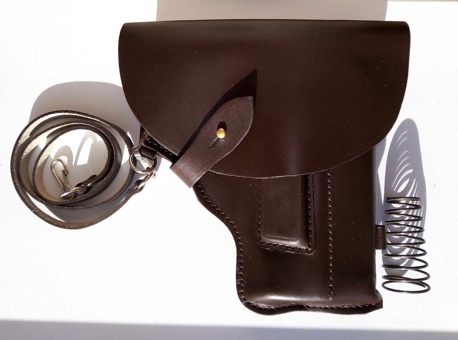 MP-654K holster leather parts Baikal with convenient compartment for the cylindrical nozzle.