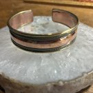 Solid Copper and brass Ladies 7 to 7 1/2” Cuff Bracelet #TS1. 1/2 inch wide. Solid Copper and brass Ladies 7 to 7 1/2” Cuff Bracelet #TS1. 1/2 inch wide.