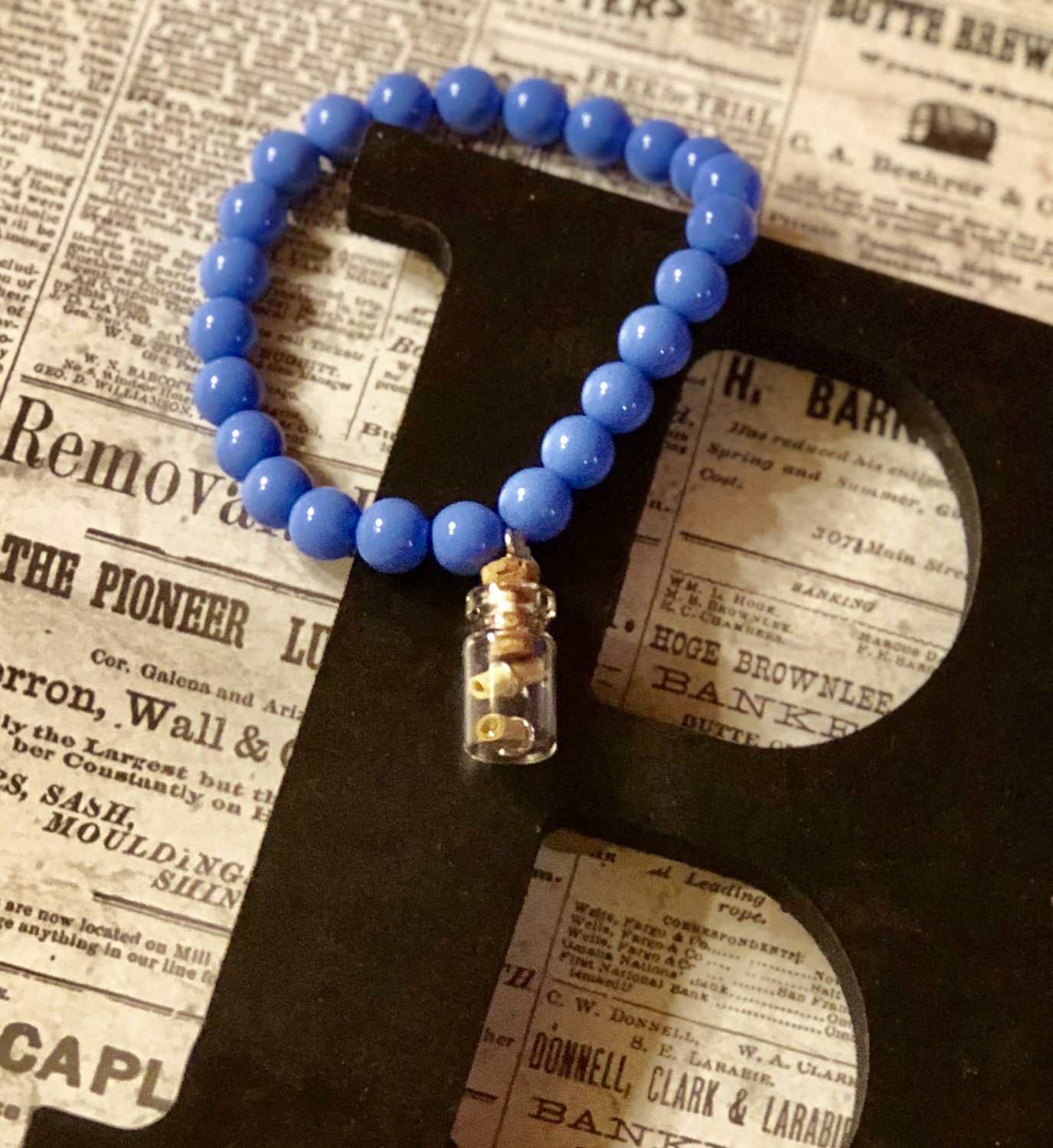 Blue Bead Bracelet with Bottle Charm
