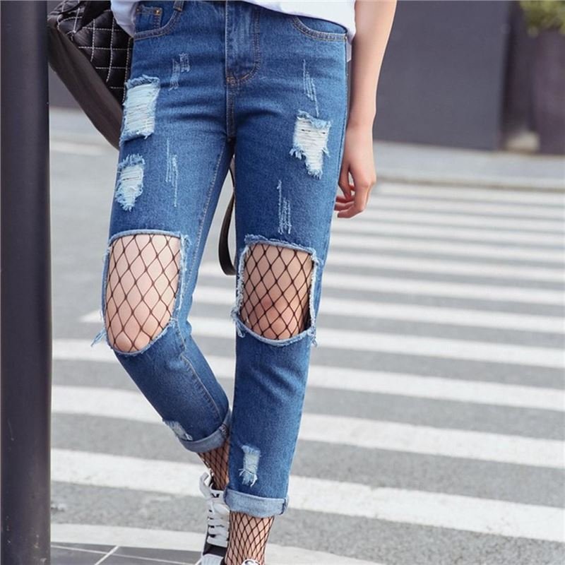 ripped jeans with fishnet tights