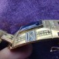 gold color vintage art deco bracelet with black enamel. blue glasses, SP brand
