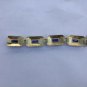 gold color vintage art deco bracelet with black enamel. blue glasses, SP brand
