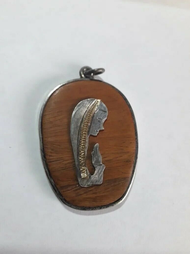old silver and wood Virgin pendant Good condition
