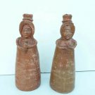 pair rustic clay candlesticks north Argentina with breakdowns