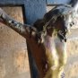 Antique old Jesus Christ on wooden cross. polychrome paper mache. breaks