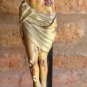Antique old Jesus Christ on wooden cross. polychrome paper mache. breaks