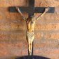 Antique old Jesus Christ on wooden cross. polychrome paper mache. breaks