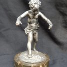 old silver metal boy figure with marble base