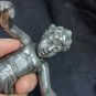 old silver metal boy figure with marble base