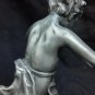 old silver metal boy figure with marble base
