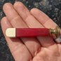 vintage bakelite seal  art deco red color and beige