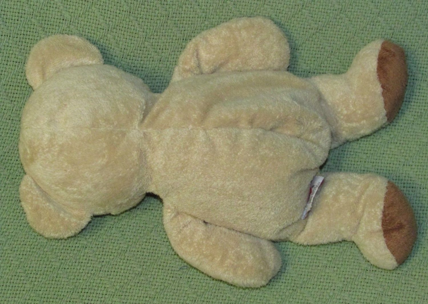 teddy bear with stitched eyes