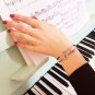 Treble clef bracelet, sterling silver