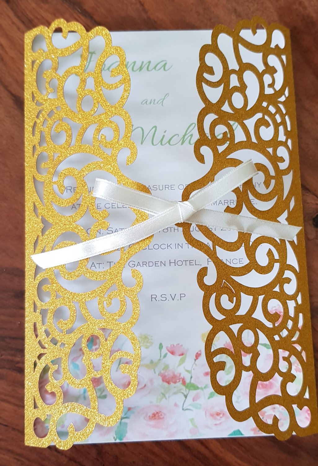 Gold Glitter laser cut wedding invitation cards.