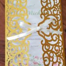 Gold Glitter laser cut wedding invitation cards.