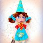 Collectible textile doll.