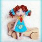 Collectible textile doll.