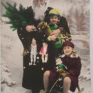 Antique Christmas Postcard Santa Claus Dressed in Black Holding Child France