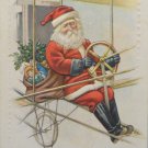 Antique Christmas Postcard Santa Claus Flying an Airplane Embossed Unposted