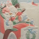 Antique Christmas Postcard Santa Claus Driving a Car Embossed Divided Posted