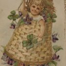 Antique Birthday Postcard Little Girl in a Basket Embossed Unposted