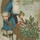 Christmas Postcard Santa Claus Wearing Blue Robe Pushing Wheelbarrow Unposted