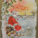 Antique Christmas Postcard Santa Claus Sitting on a Rock with Toys posted